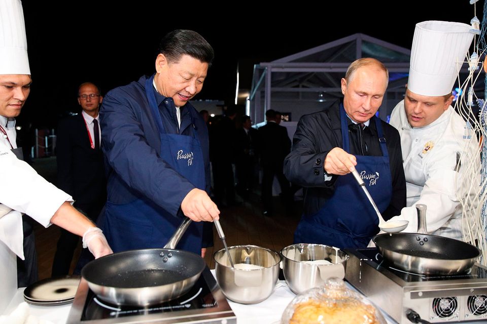 Presidents Vladimir Putin and Xi Jinping make pancakes at the Eastern Economic Forum in Vladivostok, Russia. Photo: Reuters