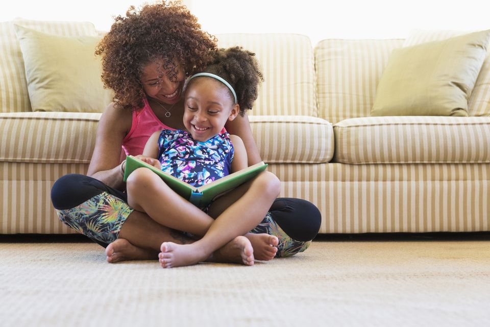 Reading with your kids is a great way to teach them about the world around them. Photo: Getty Images/Tetra images RF