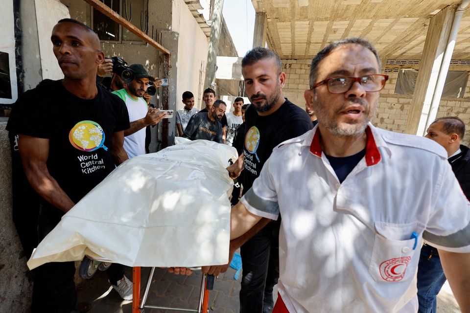 People carry the body of one of the foreign workers from the World Central Kitchen (WCK), who were killed in an Israeli airstrike, before they are transported to their families outside Gaza. Photo: Mohammed Salem/Reuters