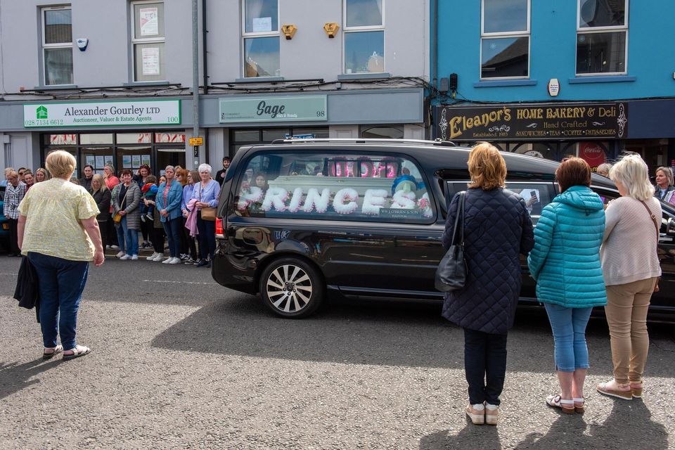 Rebecca Browne's remains are driven past Sage Hair and Beauty in the Waterside, Co Derry, where she worked. Photo: Martin McKeown