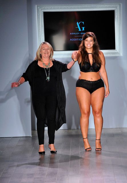 Designer Ashley Graham (R) acknowledges the audience following the Addition Elle/Ashley Graham Lingerie Collection fashion show during the Spring 2016 Style 360 on September 15, 2016 in New York City.  (Photo by Fernando Leon/Getty Images)