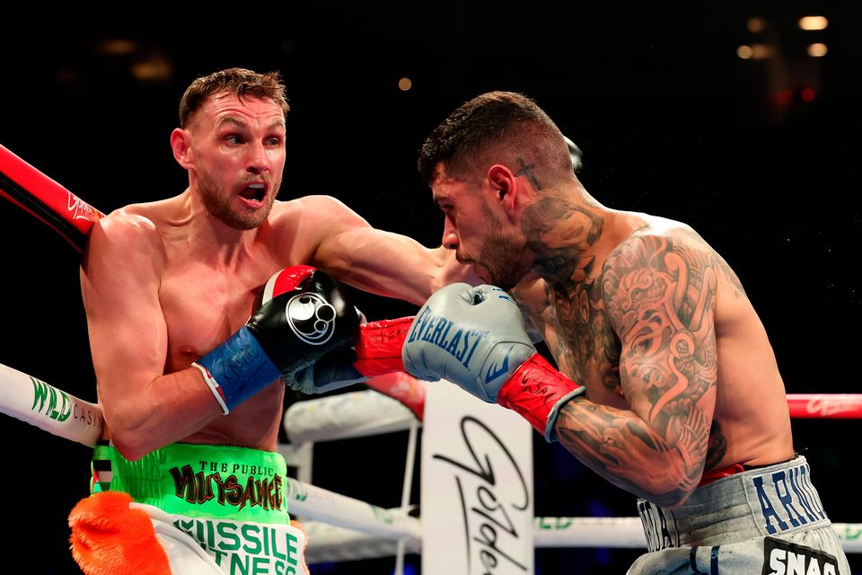 Seán McComb takes the fight to American boxer Arnold Barboza Jr during their bout at Barclays Center