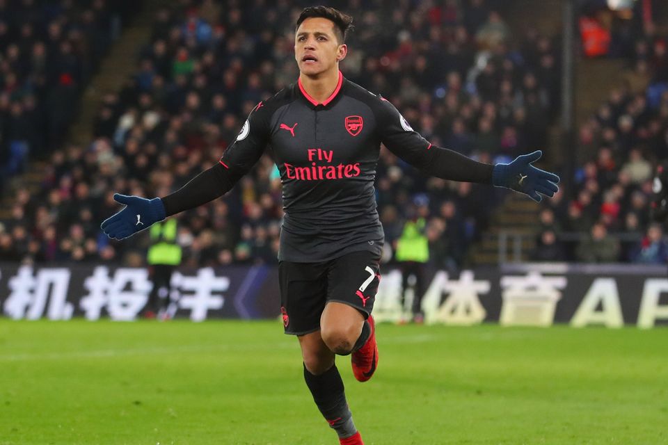 Alexis Sanchez of Arsenal celebrates as he scores their third goal during the Premier League match between Crystal Palace and Arsenal at Selhurst Park on December 28, 2017 in London, England.  (Photo by Catherine Ivill/Getty Images)
