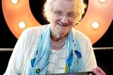 thumbnail: Marie O'Gorman with her computer at an Age Action event