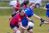 thumbnail: Coláiste Bhríde's Laci-Jane Shannon tries to stop Caroline McGarry of St. Mary's. 