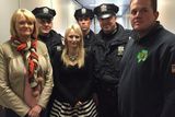 thumbnail: At Newark Liberty International Airport today, Port Authority Police officers welcomed the mother and wife of Garda Brian Hanrahan. His mother, Rosemary Hanrahan, and wife, Emma Holland, are seen here with (l-r) Officers Slavek Wdoviak, Greg Ross, Mike Becker and Bob Wallace.
Pic: Port Authority Police Benevolent Association