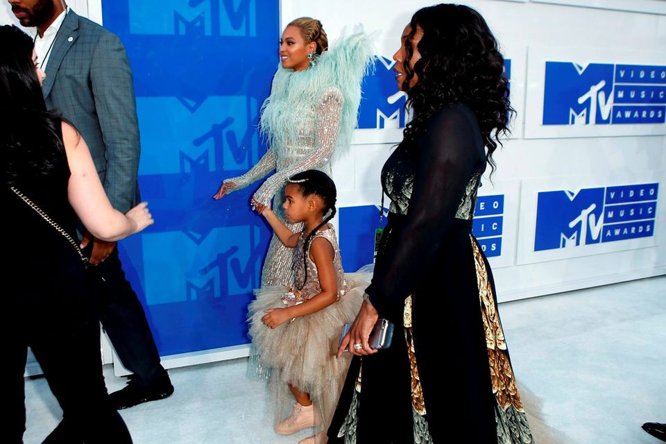 Singer Beyonce, with daughter Blue Ivy, arrive at the 2016 MTV Video Music Awards in New York. Reuters/Eduardo Munoz
