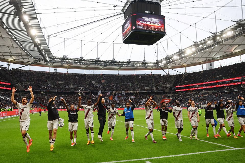 Bayer Leverkusen players celebrate after the Bundesliga win over Eintracht Frankfurt at Deutsche Bank Park, Frankfurt