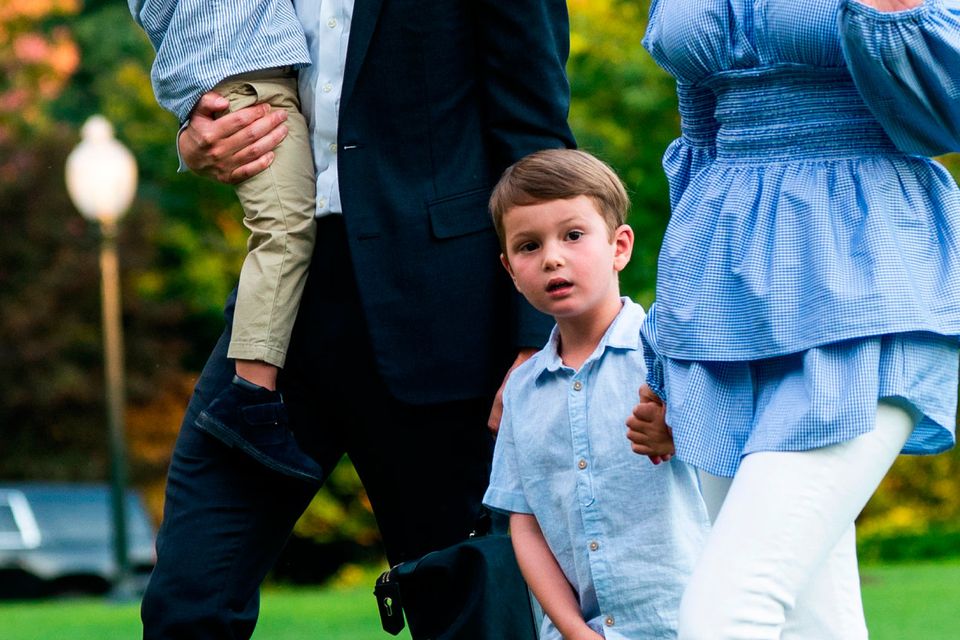 Jared Kushner (C-L) and Ivanka Trump (R) walk with their children Theodore (L) and Joseph (C-R) across the South Lawn as they return from a weekend stay in Bedminster, New Jersey at the White House