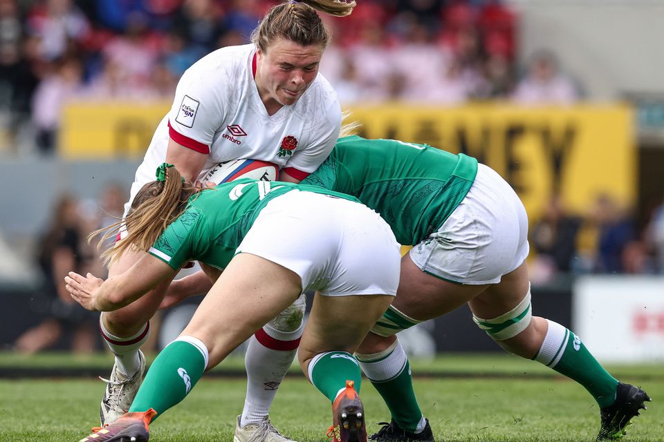 Neve Jones and Edel McMahon of Ireland tackle Sarah Bern of England during the Women's Six Nations match at Welford Road in Leicester, England. Photo: Darren Staples/Sportsfile