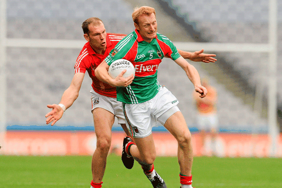 Determination is the name
of the game as Mayo's Richie
Feeney battles it out with
ALAN O'CONNOR. Photo: 
RAY MCMANUS / SPORTSFILE