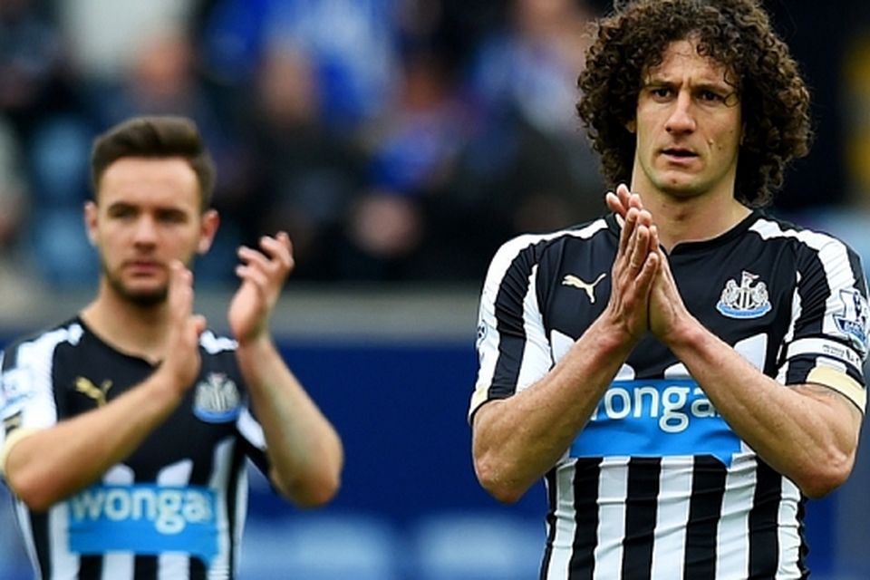 Adam Armstrong (L) and Fabricio Coloccini of Newcastle United look dejected after the Barclays Premier League match between Leicester City and Newcastle United at The King Power Stadium