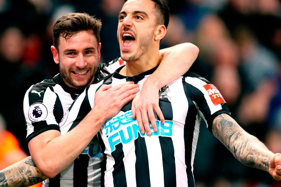 Newcastle United's Joselu (right) celebrates scoring his side's first goal of the game with team mate Paul Dummett