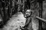 thumbnail: A young child playing on his own near his home in Chitpur slum in Kolkata, India. Photo: Arthur Carron