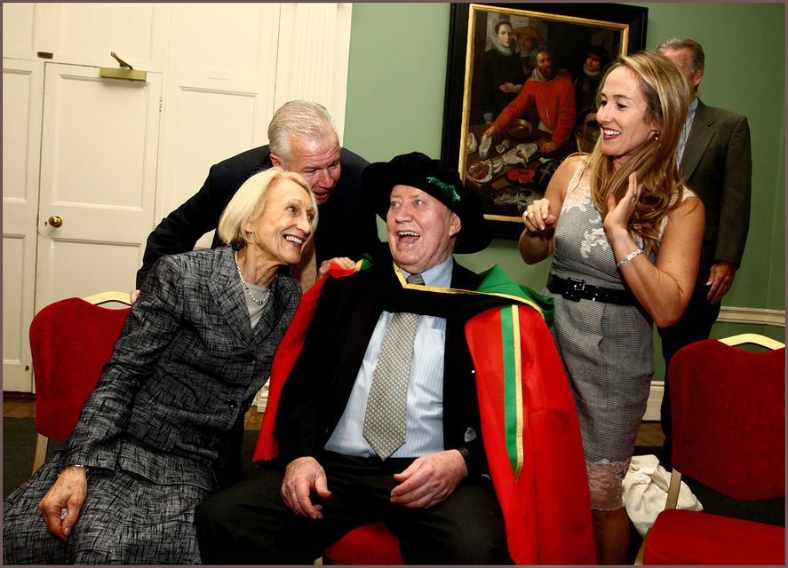 Charles “Chuck” Feeney receives an honorary Doctorate of Laws jointly by all the universities on the island of Ireland at Dublin Castle in 2010 surrounded by family including wife Helga (left). Picture By David Conachy