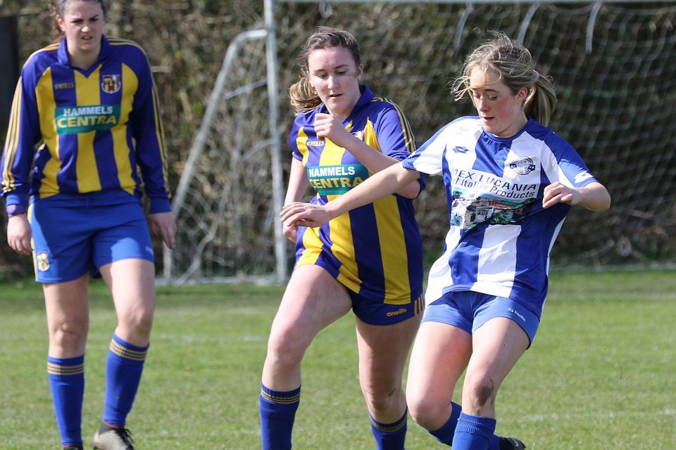 Aughrim's Laci-Jane Shannon gets away from Caitlyn Redmond of St. Joseph's.