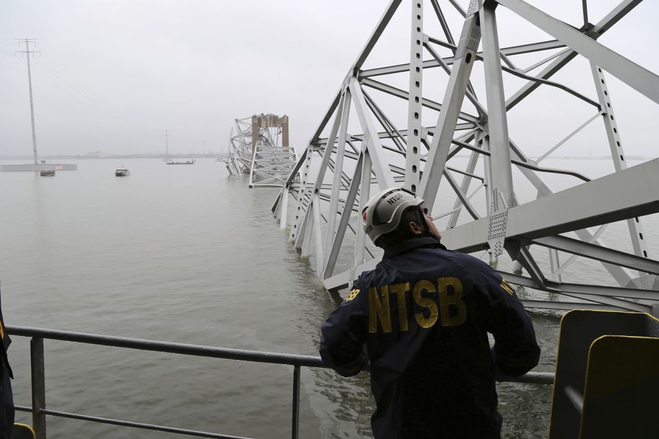 In this image released by the National Transportation and Safety Board, a NTSB investigator is seen on the cargo vessel Dali, which struck and collapsed the Francis Scott Key Bridge (Peter Knudson/NTSB/AP)