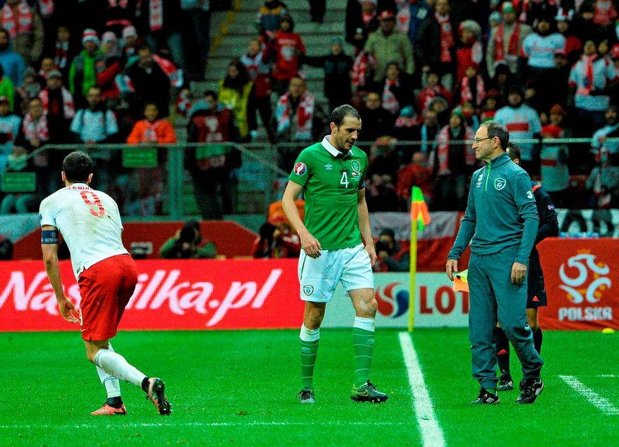 John O’Shea leaving the field after his late red card against Poland in Warsaw