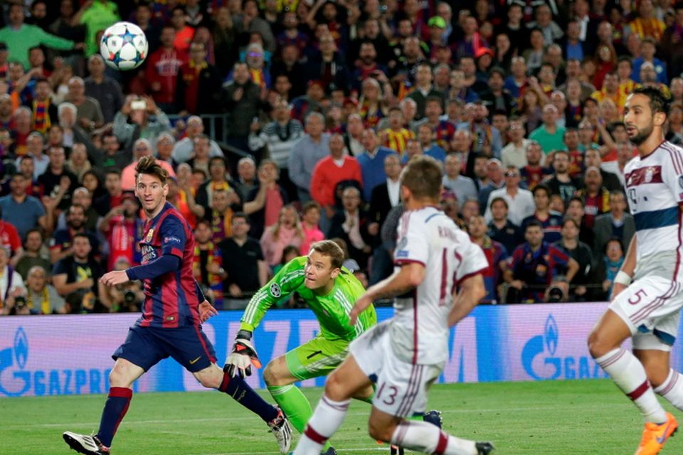 Barcelona's Lionel Messi, left, scores his second goal past Bayern's goalkeeper Manuel Neuer during the Champions League semifinal first leg soccer match between Barcelona and Bayern Munich at the Camp Nou stadium in Barcelona, Spain, Wednesday, May 6, 2015.  (AP Photo/Emilio Morenatti)