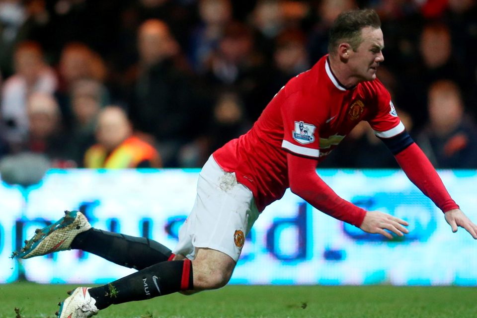 Manchester United's Wayne Rooney falls to the ground after Preston's Thorsten Stuckmann (not pictured) conceded a penalty against him