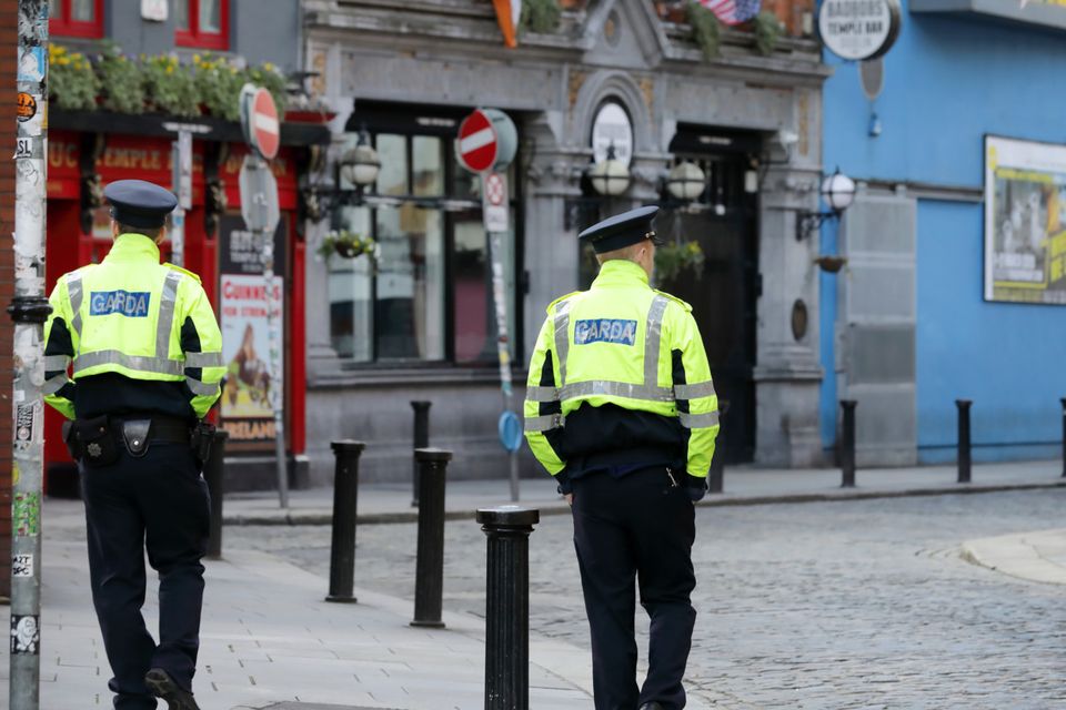 Garda pictured in Temple Bar which is very quiet due to the impact of the Coronavirus