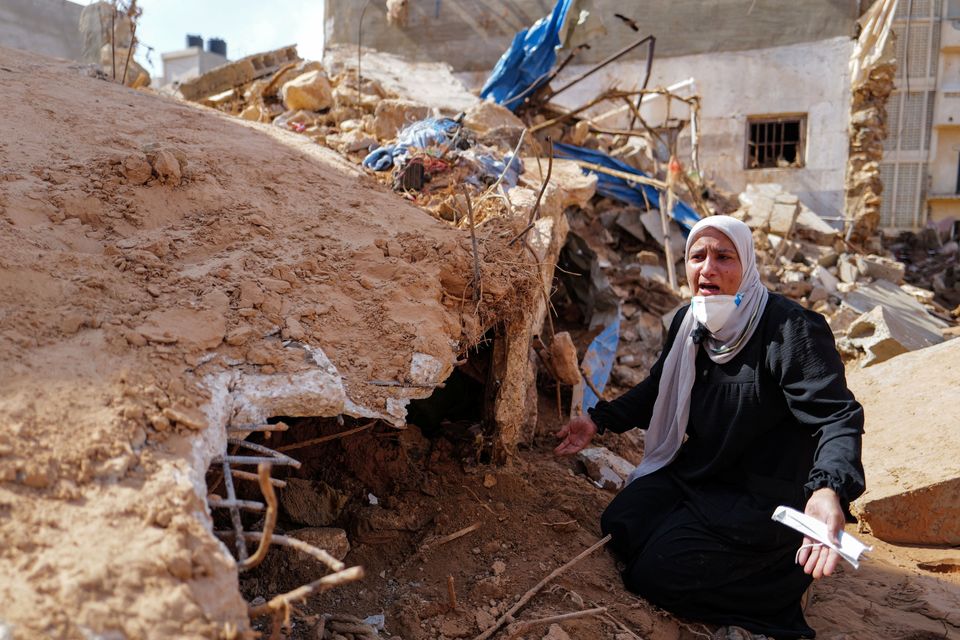 Sabrine Ferhat Bellil, who lost her brother, his wife and five of his children when the deadly storm hit Derna, hopes to find the bodies beneath the rubble so they can be buried. Photo: Zohra Bensemra/Reuters