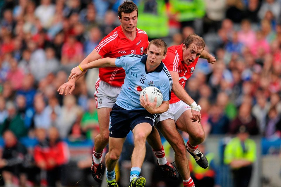 Dublin’s Tomás Quinn attempts to get away from Cork duo Fiachra Lynch, left, and Paudie Kissane during the 2011 NFL final. Ray McManus / SPORTSFILE