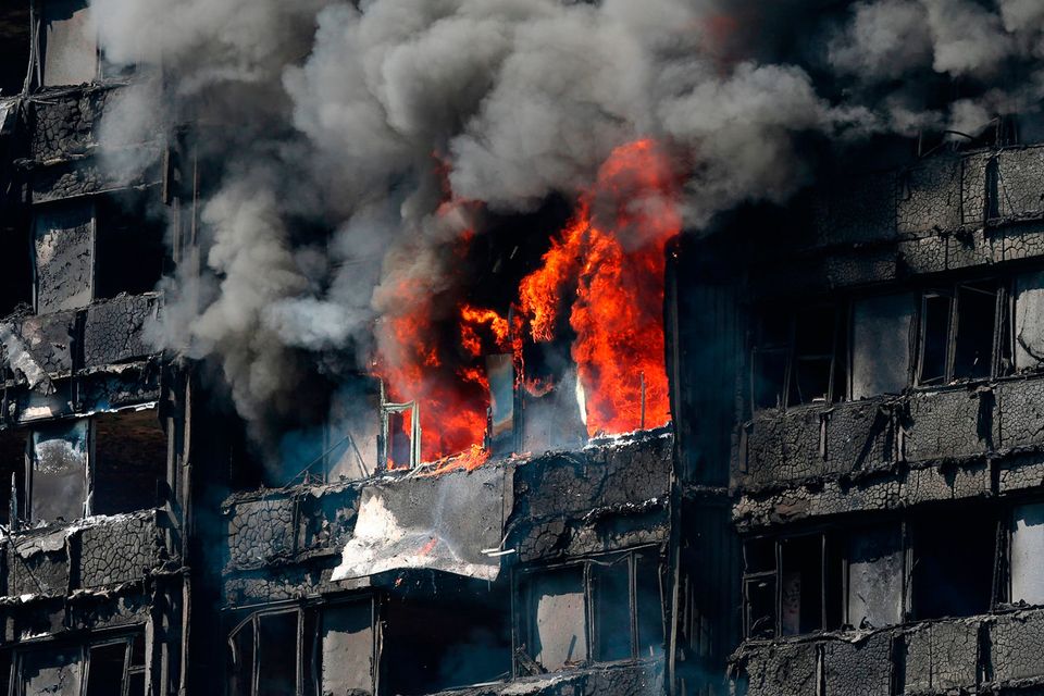 Smoke billows from a fire that has engulfed the 24-storey Grenfell Tower in west London.  PRESS ASSOCIATION Photo. Picture date: Wednesday June 14, 2017. More than 200 firefighters were sent to tackle the blaze and London Ambulance Service said 30 people had been taken to five hospitals. See PA story FIRE Grenfell. Photo credit should read: Jonathan Brady/PA Wire