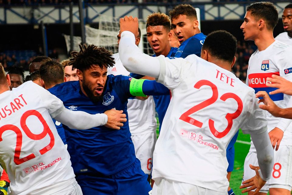 Ashley Williams clashes with Lyon players at Goodison Park. Photo: Ross Kinnaird/Getty Images
