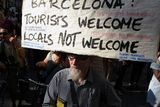thumbnail: A protesters carry a banner that reads, "Barcelona: Tourist welcome, locals not welcome"  during a demonstration in Barcelona on June 10, 2017 against what they claim is a lack of control by the city's tourism management. Photo: AFP