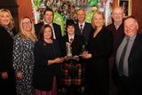 thumbnail: Teresa Irwin presents the The Peter Irwin Memorial Perpetual Award for Best Marching Group/Cultural Arts to Gillian McCarthy, Millstreet Pipe Band. Also included are Bridget O'Keeffe (Killarney Chamber of Tourism and Commerce Senior Executive), Ciara Irwin Foley, Cllr Niall Kelleher, Mayor of Killarney, and PJ McGee, Daly's SuperValu, sponsor, Emir Irwin O'Shea, Cathal Walshe, Grand Marshal, and St. Patrick's Festival Killarney Chairman Paul Sherry at the St. Patrick's Festival Killarney parade prizegiving function in The International Hotel on Tuesday night. Picture: Eamonn Keogh