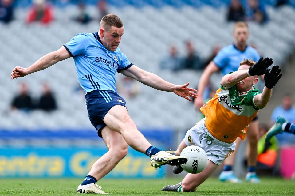 Con O'Callaghan of Dublin scores his side's first goal, under pressure from Lee Pearson of Offaly