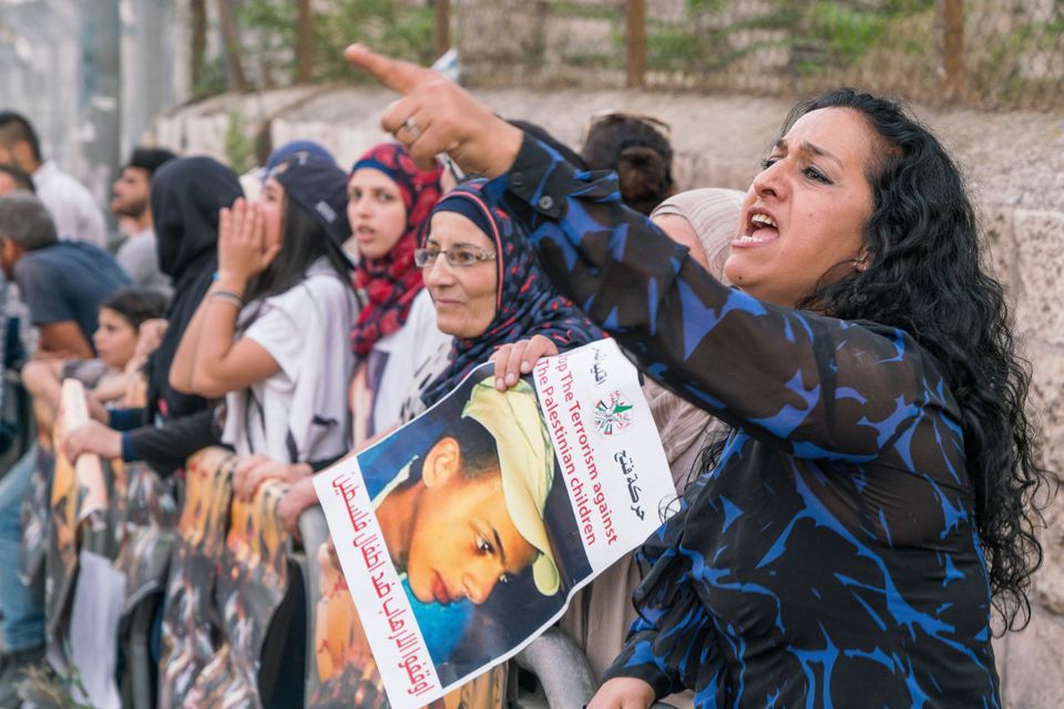Protests at the trial of an Israeli man charged with burning a 15-year
-old Palestinian boy to death in a local park. He got a life sentence.