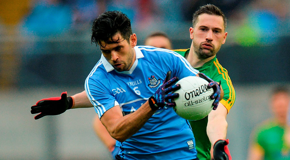 Dublin's Cian O'Sullivan keeps the ball away from Meath's Mickey Newman. Photo: Piaras Ó Mídheach/Sportsfile