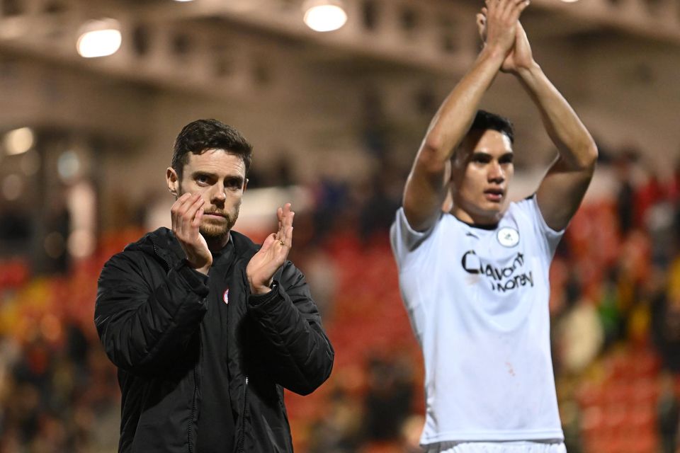 John Russell and Max Mat acknowledge the fans after drawing 1-1 with Derry City on Friday night. Pic: Stephen McCarthy/Sportsfile.
