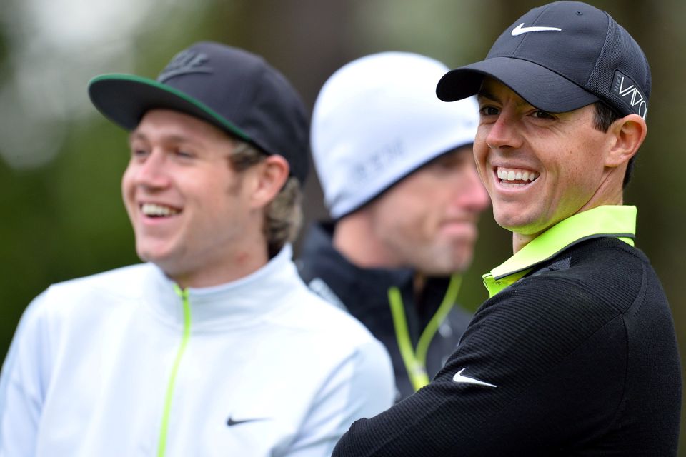 Rory McIlroy (R) and One Direction singer Niall Horan