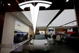 thumbnail: Visitors check a Tesla Model 3 car in Beijing, China February 4, 2023. Photo: Florence Lo/Reuters