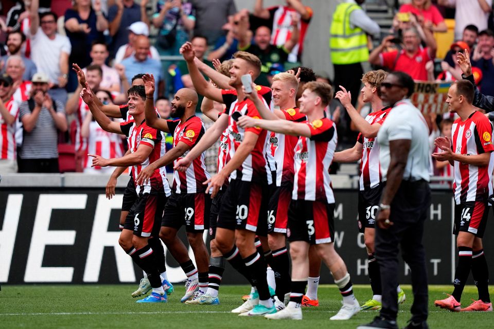 Brentford's players celebrate on the pitch after the Premier League win over Crystal Palace at the Gtech Community Stadium, Brentford