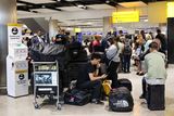 thumbnail: Travellers wait near the British Airways check-in area at Heathrow Airport, as Britain's National Air Traffic Service (NATS) restricts UK air traffic due to a technical issue causing delays, in London, Britain, August 28, 2023. REUTERS/Hollie Adams/File Photo