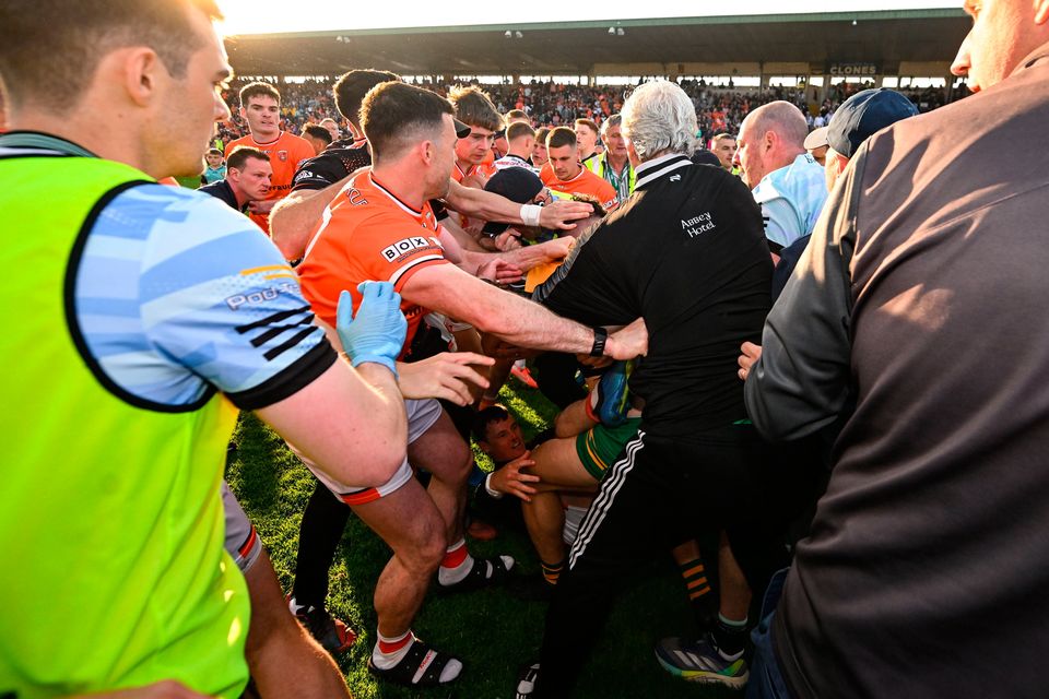 Players from Armagh and Donegal tussle after the match