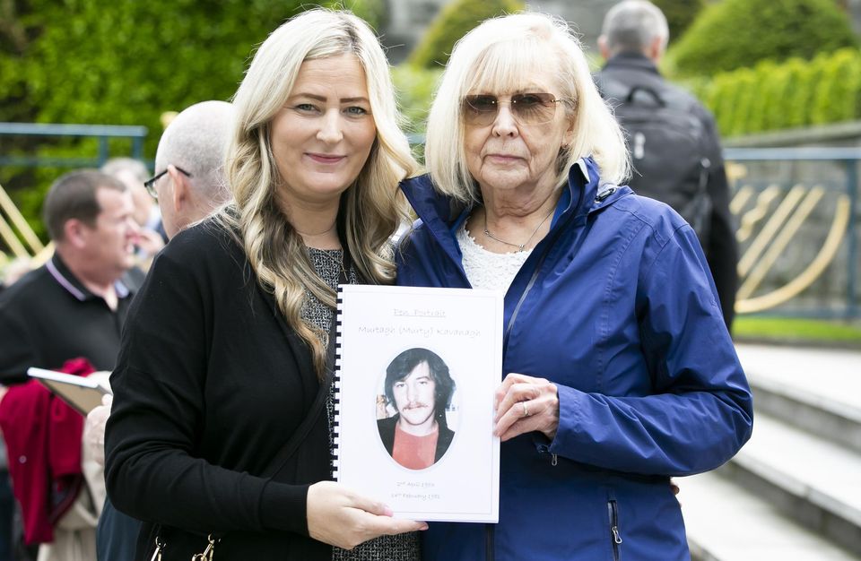 Rachel Byrne with her aunt Terry Jones hold a photo of Murtie Kavanagh (Terry's brother) at the Garden of Remembrance in Dublin. Pic: Gareth Chaney/ Collins