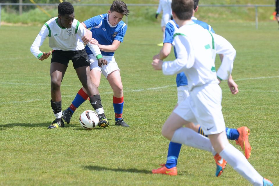19/05/15.Tobe Ositelu and Daniel Stewart battle it out during the Under 15s soccer final between Colaiste Phadraig CBS and Templeouge College at Peamount Utd.
Pic: Justin Farrelly.