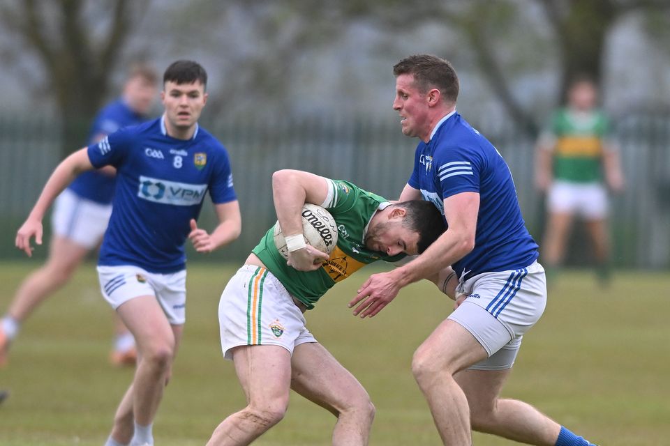 Sean O'Mahonys' Aaron Boyle is tackled by Ronan Carroll of Ardee St Mary's during the clubs' Division tussle at Point Road on Friday night. Picture: Ken Finegan/Newspics