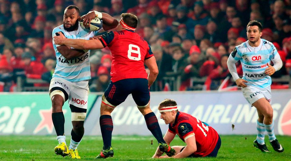Racing 92's Fijian lock Leone Nakarawa (L) is tackled by Munster's South African-born Irish number 8 CJ Stander. Photo: Getty Images