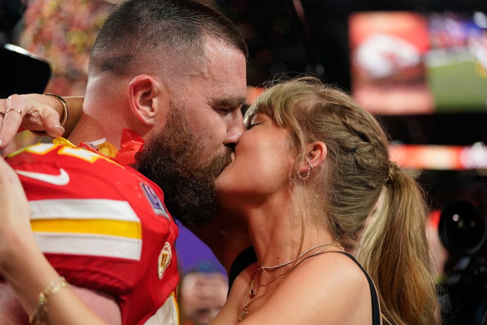 Taylor Swift kisses Kansas City Chiefs tight end Travis Kelce after the NFL Super Bowl 58 football game against the San Francisco 49ers on Sunday, Feb. 11, 2024, in Las Vegas.  The Chiefs won 25-22 against the 49ers.  (` Photo/Brynn Anderson)