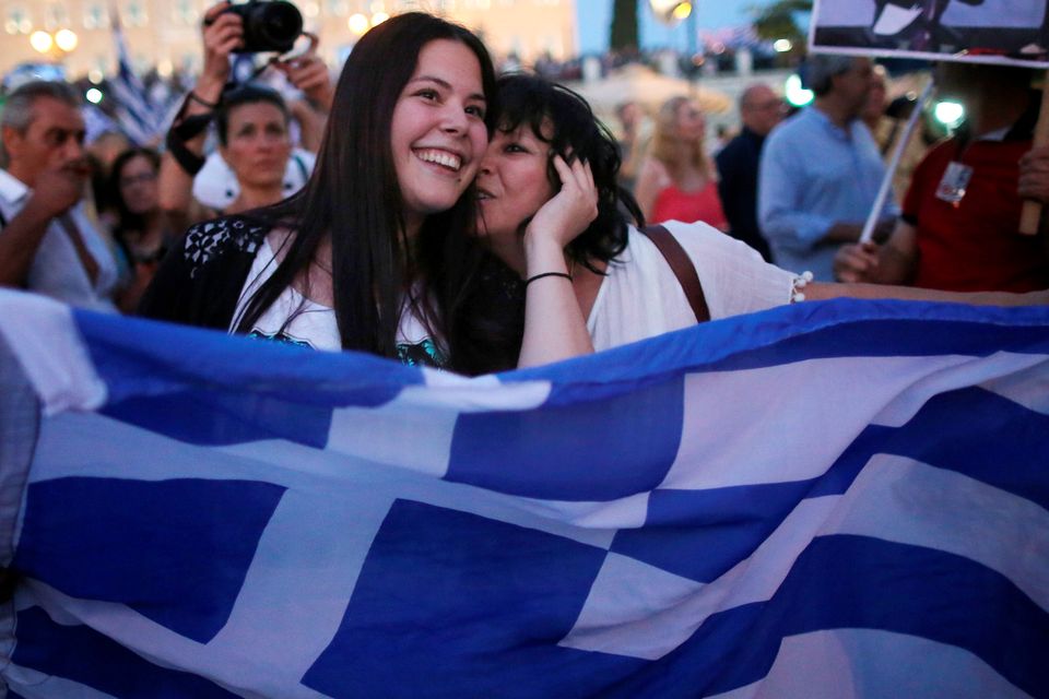 People celebrate in front of the Greek parliament as early opinion polls predict a win for the Oxi, or No, campaign in the Greek austerity referendum. Photo: Christopher Furlong/Getty Images)