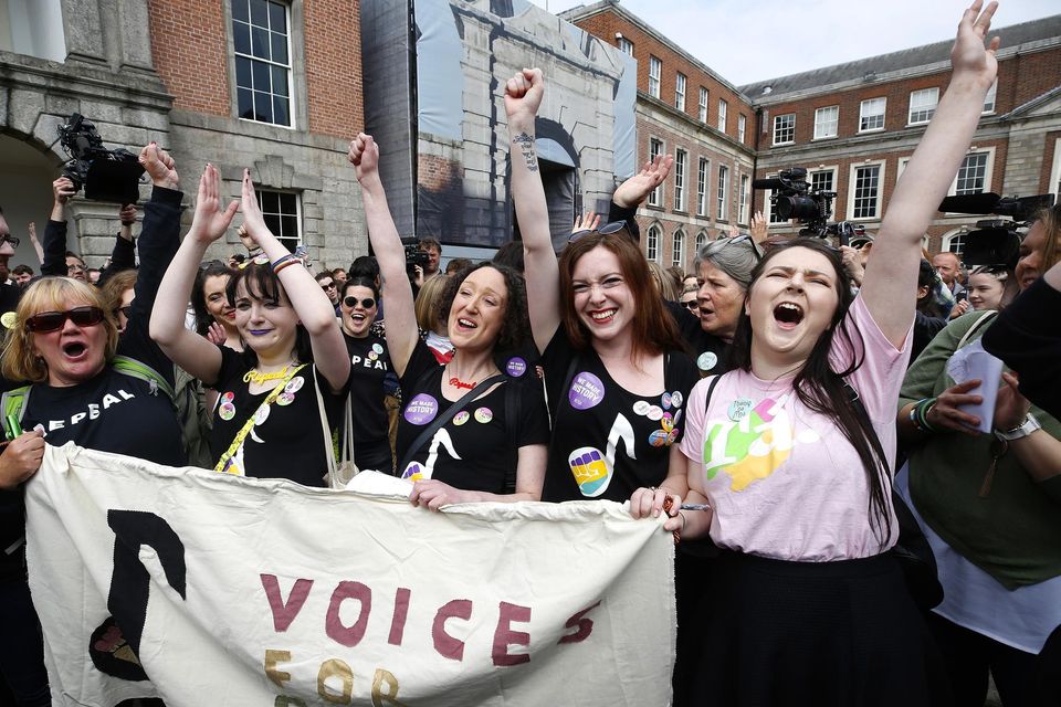 Sophie Cremin, Flora Conroy, Avril Casey, and Jenna Moran celebrate the repeal of the 8th Amendment at Dublin Castle. Photo: Damien Eagers
