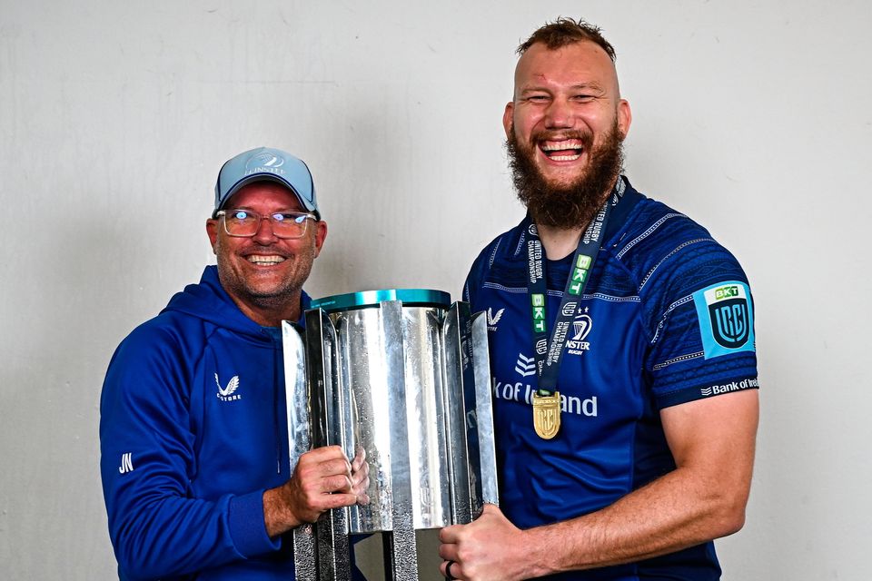 Leinster senior coach Jacques Nienaber, left, and RG Snyman celebrate with the URC trophy. Photo: Brendan Moran/Sportsfile