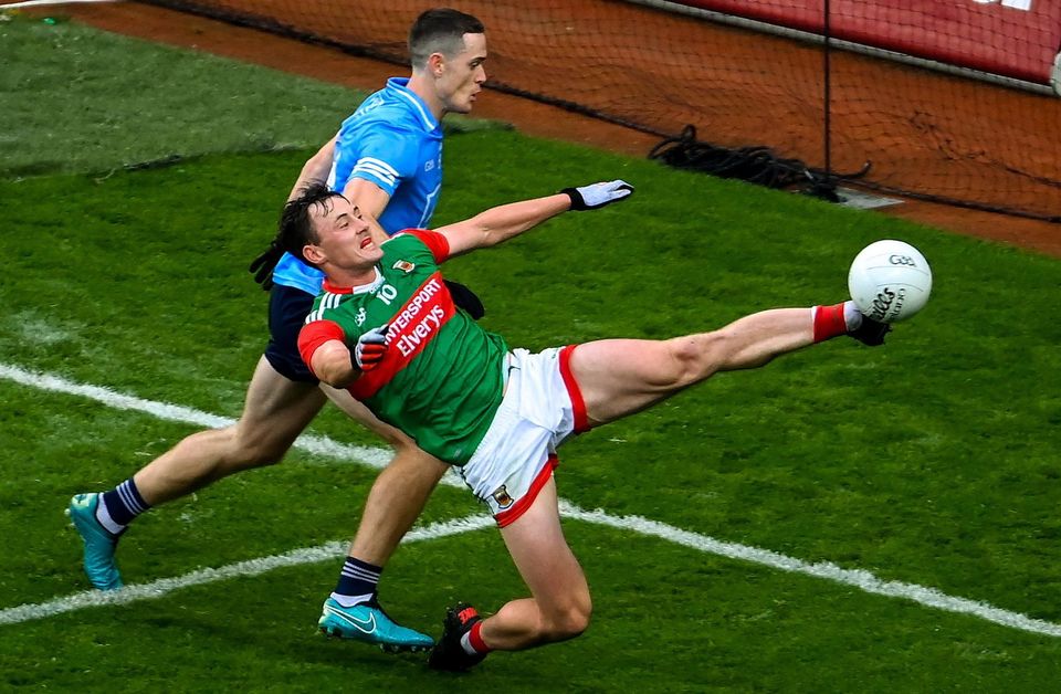 Diarmuid O'Connor of Mayo keeps the ball in play against Dublin in the 2021 All-Ireland SFC semi-final