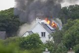 thumbnail: Fire crews attend to the scene of a house fire in North Clare this afternoon believed to have been started by a lightning strike (Photograph: Liam Burke, Press 22)